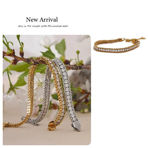 Gold and silver chain bracelets with a floral background
