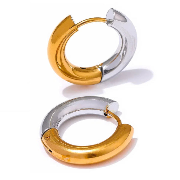 Pair of two-tone gold and silver chunky hoop earrings on a white background