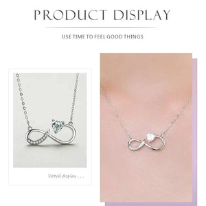 Silver infinity necklace displayed on a light pink background with text about using time to feel good things.