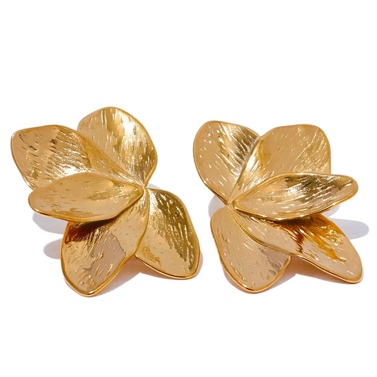 Gold-plated flower-shaped stud earrings with textured petals on white background