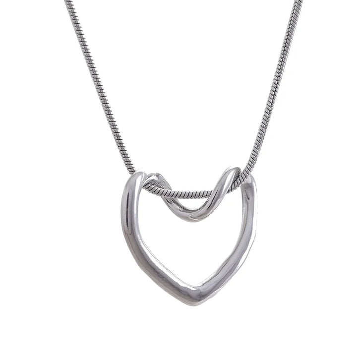 Silver necklace with a unique pendant on a white background