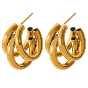 Chunky triple hoop gold-plated statement earrings for women on white background