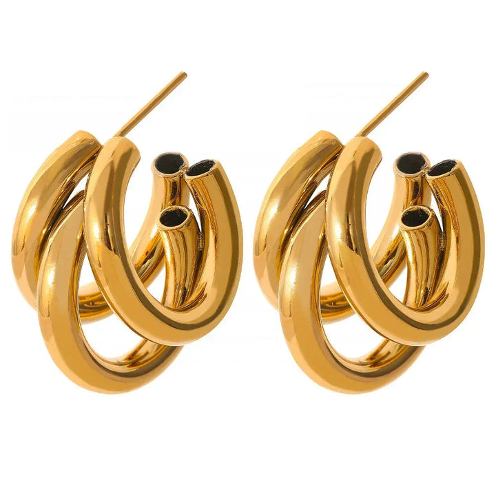 Chunky triple hoop gold-plated statement earrings for women on white background