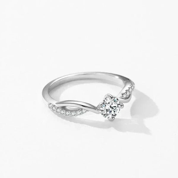 925 silver ring with round center stone and pavé accents on white background
