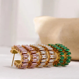 Decorative item with green, white, and gold elements on a light background