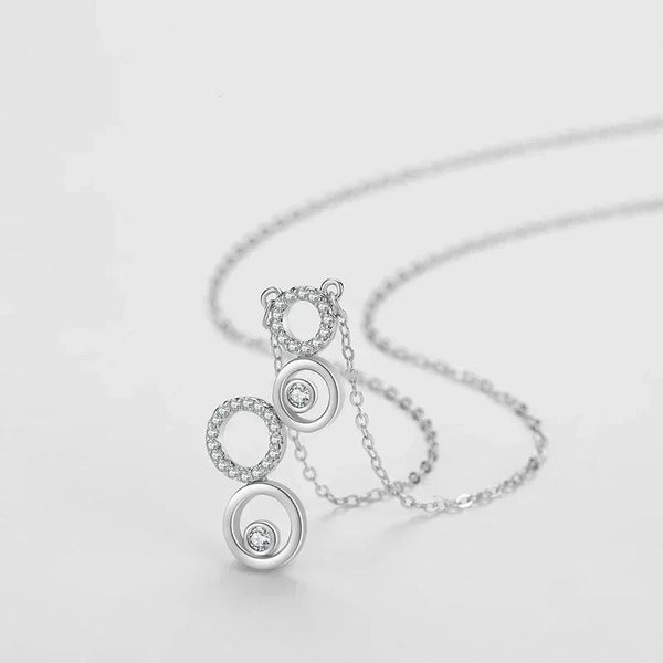 Silver necklace with a unique pendant design on a light gray background-Shining CZ Bubble Pendant Necklace - TM & CO. JEWELS 
