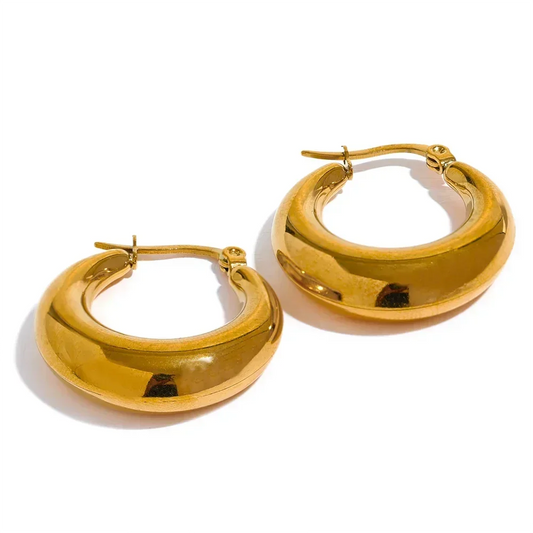 Pair of chunky gold-plated hoop earrings, polished finish, on white background