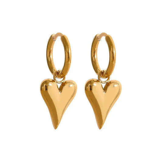 Gold-plated hoop earrings with dangling heart-shaped charms on white background
