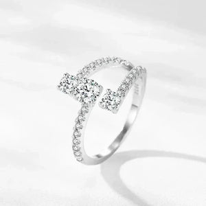 Elegant sterling silver ring with sparkling round and rectangular cubic zirconia stones