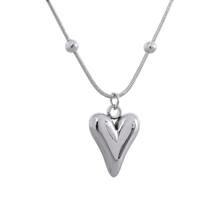 925 silver heart pendant necklace with beaded accents on a snake chain, minimalist style