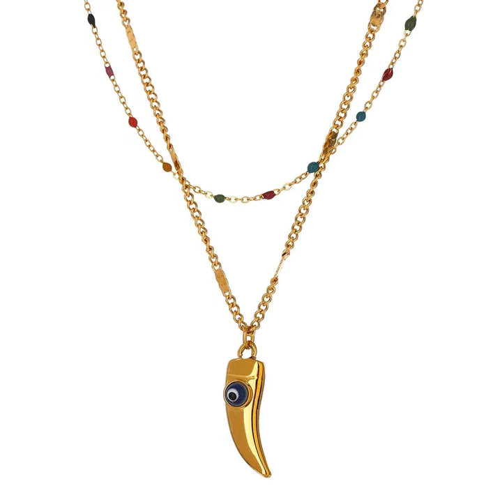 Gold necklace with a unique pendant on a white background