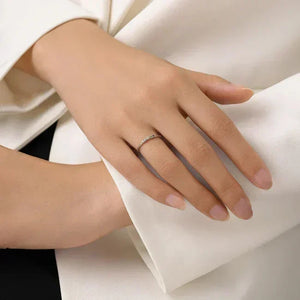 Prism Glow Stackable Ring - TM & Co. Jewels-Hand wearing a ring on a white fabric background.