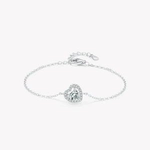 Sterling silver bracelet with heart-shaped gemstone and adjustable chain on white background