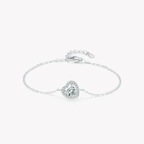 Sterling silver bracelet with heart-shaped gemstone and adjustable chain on white background
