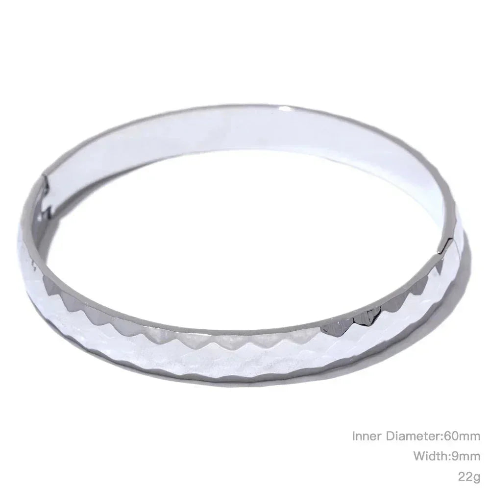 Sterling silver bangle bracelet with hammered texture, 60mm diameter, 9mm wide