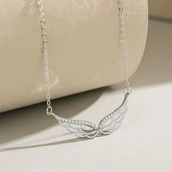 Silver necklace with a decorative pendant on a beige surface