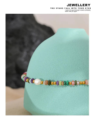 Multicolored beaded bracelet on a turquoise stand with 'Jewellery' text at the top.-Nouveau Bohème Necklace - TM & CO. JEWELS 