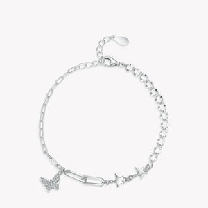 Silver bracelet with star and butterfly charms on a white background