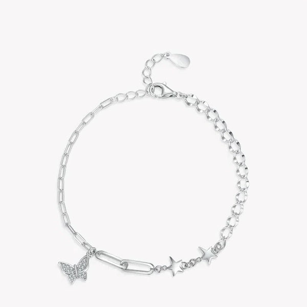 Silver bracelet with star and butterfly charms on a white background