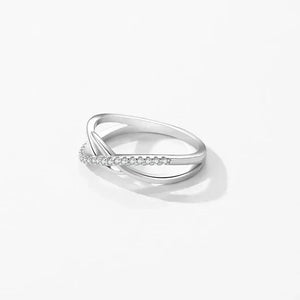 925 silver twisted infinity ring with cubic zirconia accents on white background