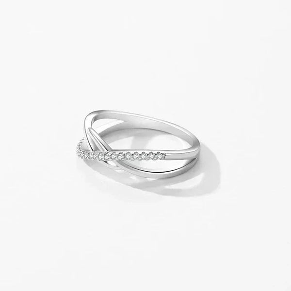 925 silver twisted infinity ring with cubic zirconia accents on white background