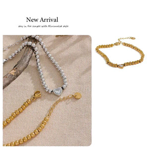 18K gold-plated beaded bracelet with a central heart-shaped charm and adjustable clasp