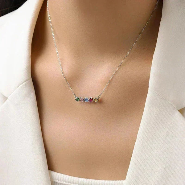 Necklace with colorful gemstones worn by a person in a white outfit-Spectrum Shine Necklace - TM & CO. JEWELS 