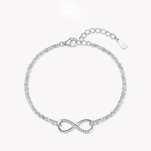 925 silver infinity bracelet with double chain and cubic zirconia accents on white background