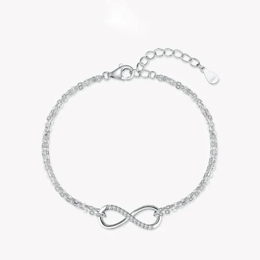 925 silver infinity bracelet with double chain and cubic zirconia accents on white background