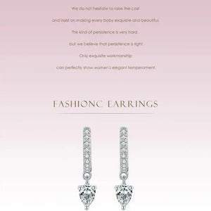 Pair of diamond earrings Sparkling Hoop Earrings - TM & CO. JEWELS on a light pink background with text.