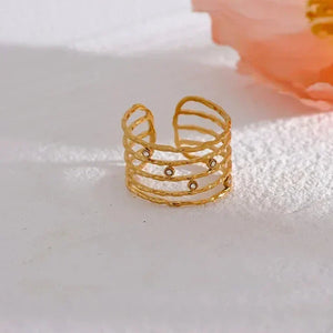 18K gold-plated open cuff ring with textured bands and small gemstone accents