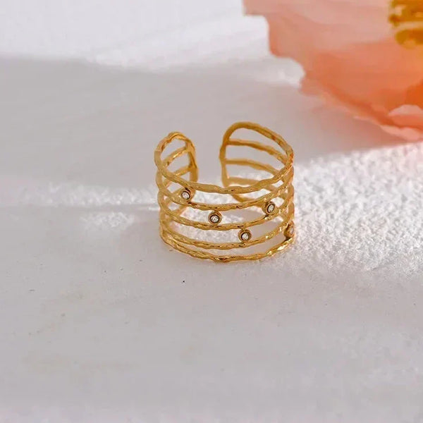 18K gold-plated open cuff ring with textured bands and small gemstone accents