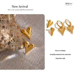 Gold heart-shaped earrings on a textured surface with 'New Arrival' text and brand name.