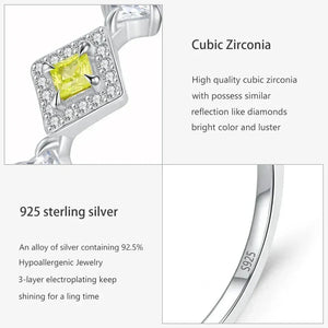 Silver earring with yellow gemstone and text about cubic zirconia and 925 sterling silver-TM & CO. JEWELS 