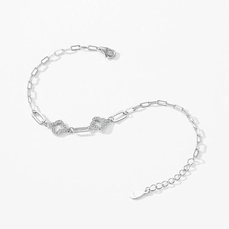 Sterling silver chain bracelet with interlocking textured links on white background