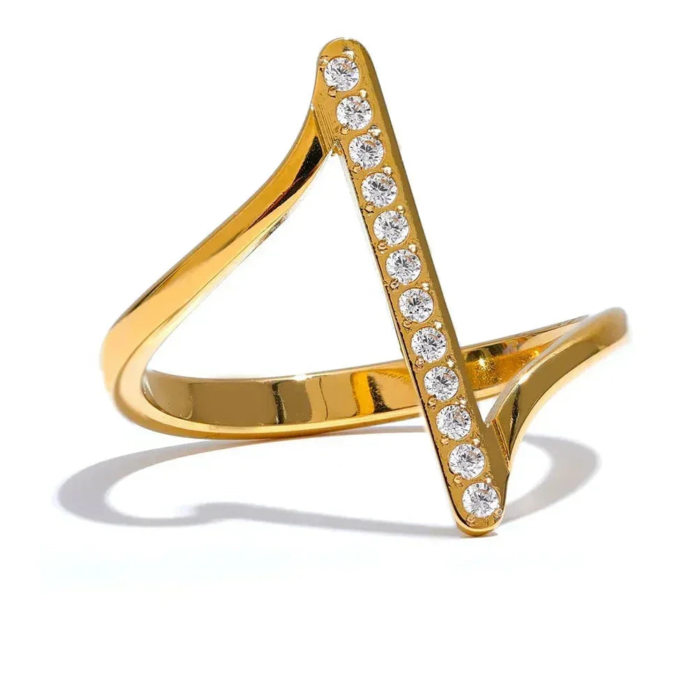 Modern gold-plated ring with geometric V shape and vertical row of clear gemstones