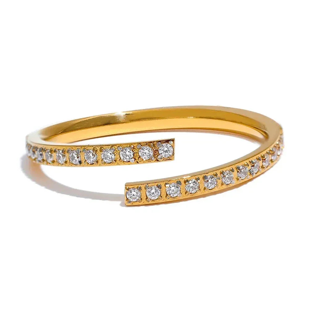 18K gold-plated open bangle bracelet with sparkling cubic zirconia stones on white background