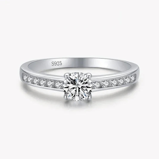 925 silver engagement ring with round solitaire and pavé-set side stones on white background