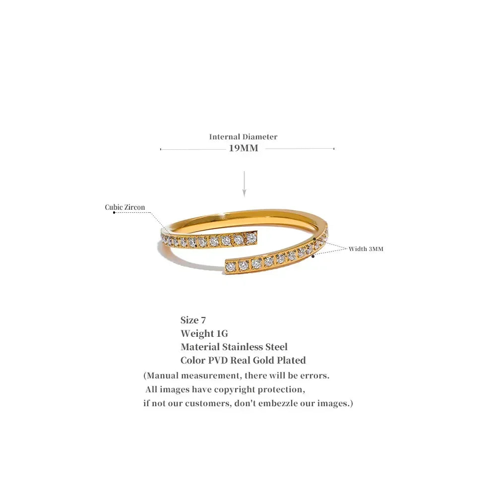 Gold-plated stainless steel ring with cubic zirconia stones, size 7, 19mm diameter, 3mm width.