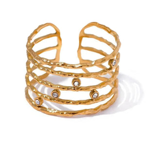 18K gold-plated open cuff ring with textured bands and small gemstone accents
