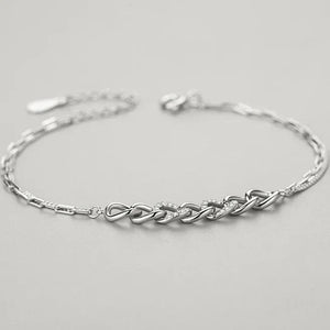Silver bracelet on a light gray background with text 'BRACELET' above it.