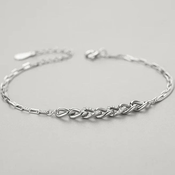Silver bracelet on a light gray background with text 'BRACELET' above it.