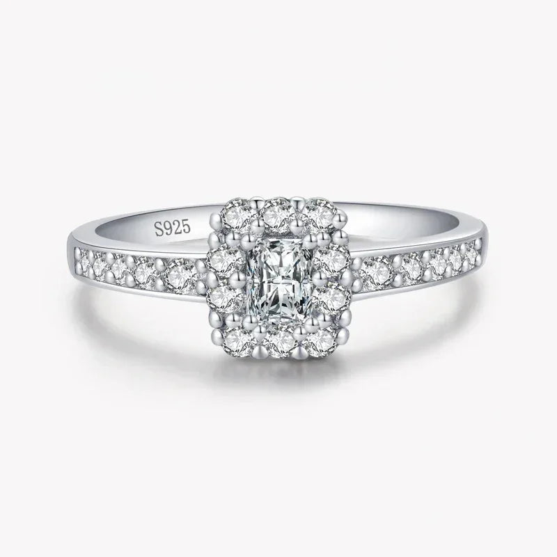 Sterling silver ring with square halo and pavé-set white stones, stamped S925.