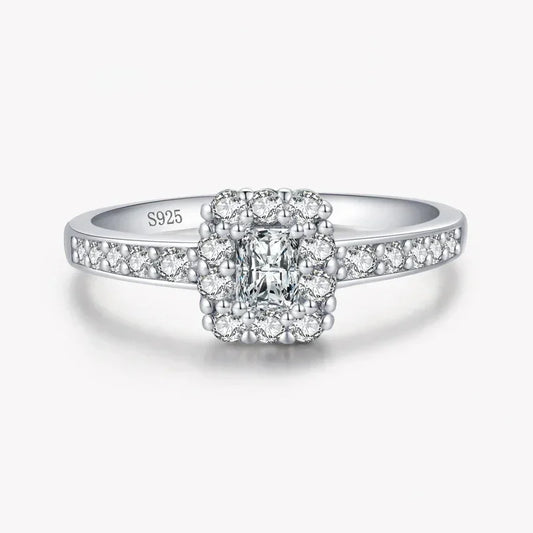 Sterling silver ring with square halo and pavé-set white stones, stamped S925.