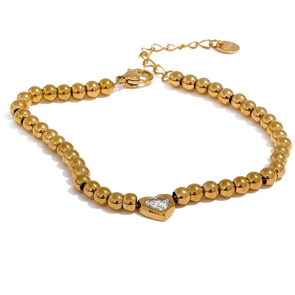 18K gold-plated beaded bracelet with a central heart-shaped charm and adjustable clasp