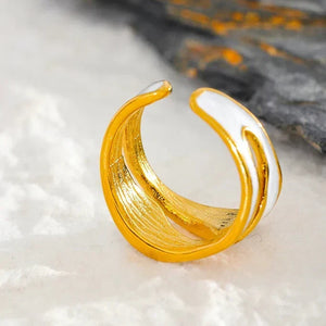18K gold-plated adjustable ring with white enamel accents on a marble background