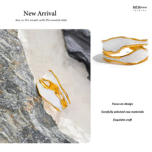 18K gold-plated adjustable ring with white enamel accents on a marble background
