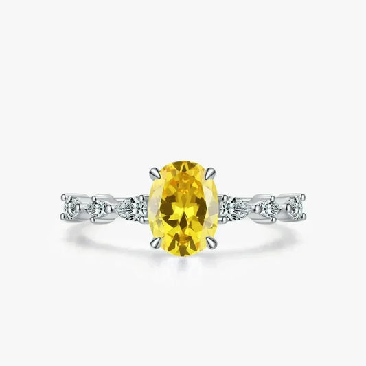 Amber Luxe Engagement Ring - TM & CO. JEWELS - Ring with a yellow gemstone and diamond accents on a white background.