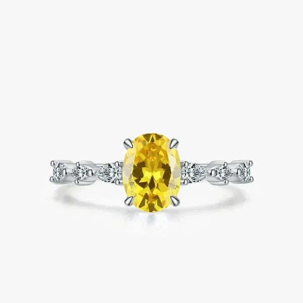 Amber Luxe Engagement Ring - TM & CO. JEWELS - Ring with a yellow gemstone and diamond accents on a white background.