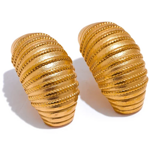 Pair of gold spiral earrings on a white background